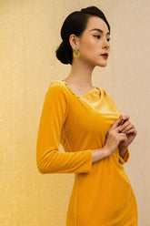 Long-sleeve velvet dress with cowl neckline and tailored fit for elegant evening occasions